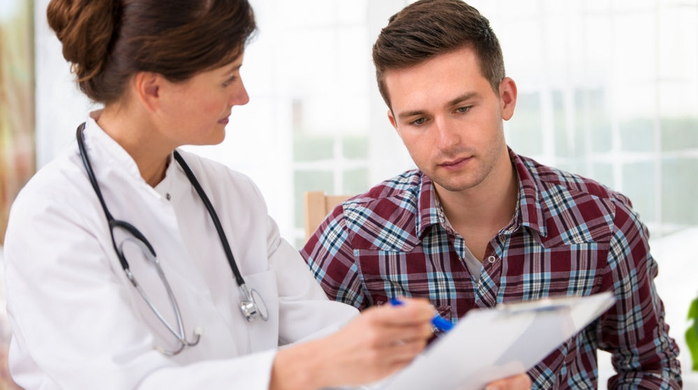 man talking to doctor