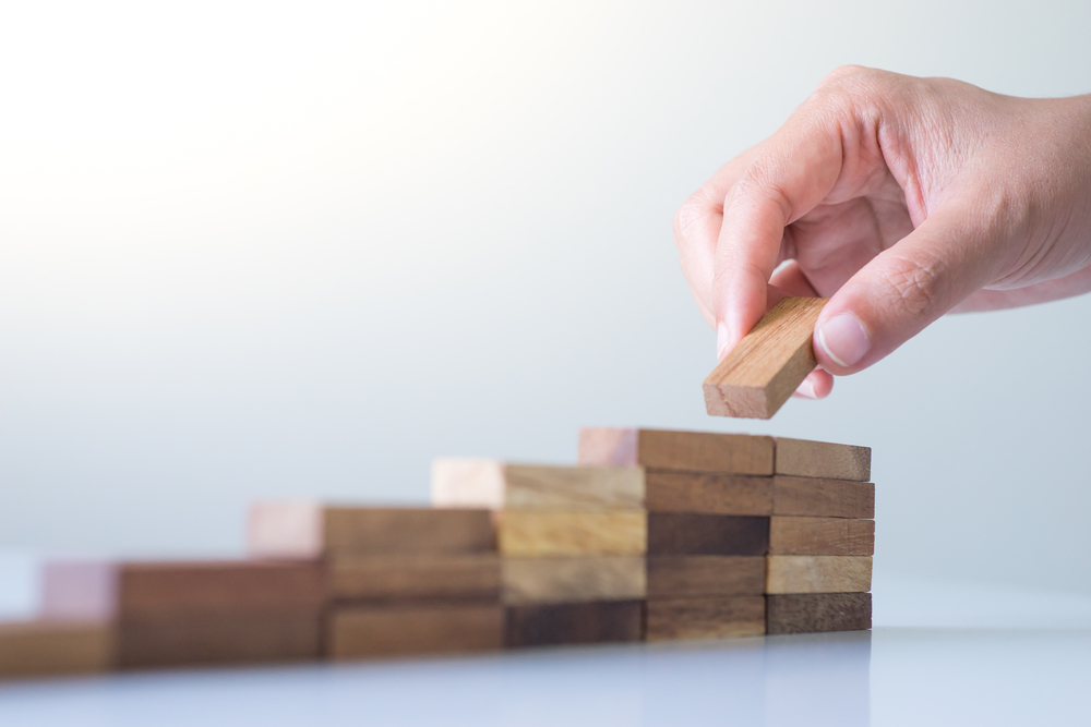 Stacking small wooden blocks