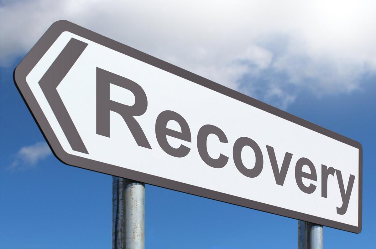Road sign with the words Recovery on it