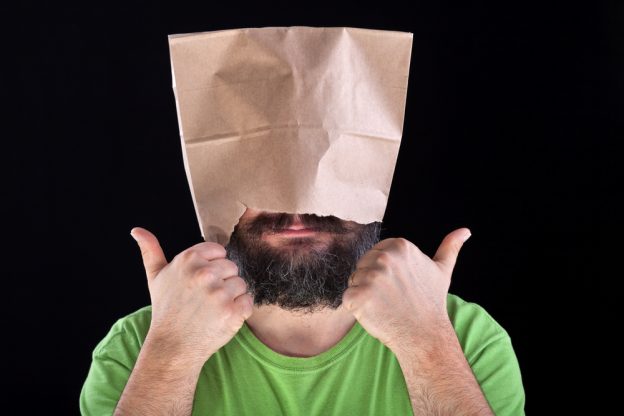 Man with paper bag over his head - thumbs up