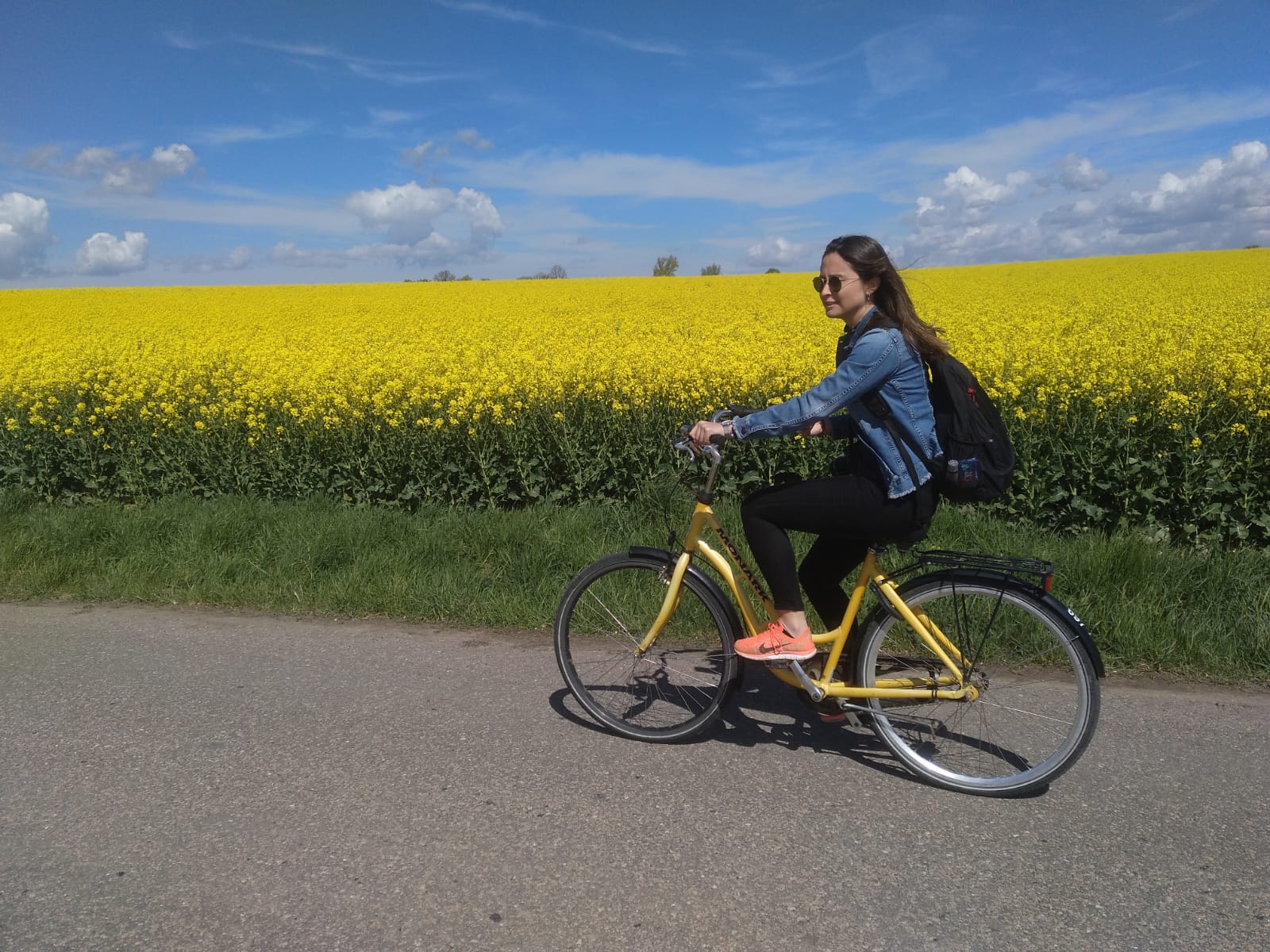 Chiara Nava riding bike in fields